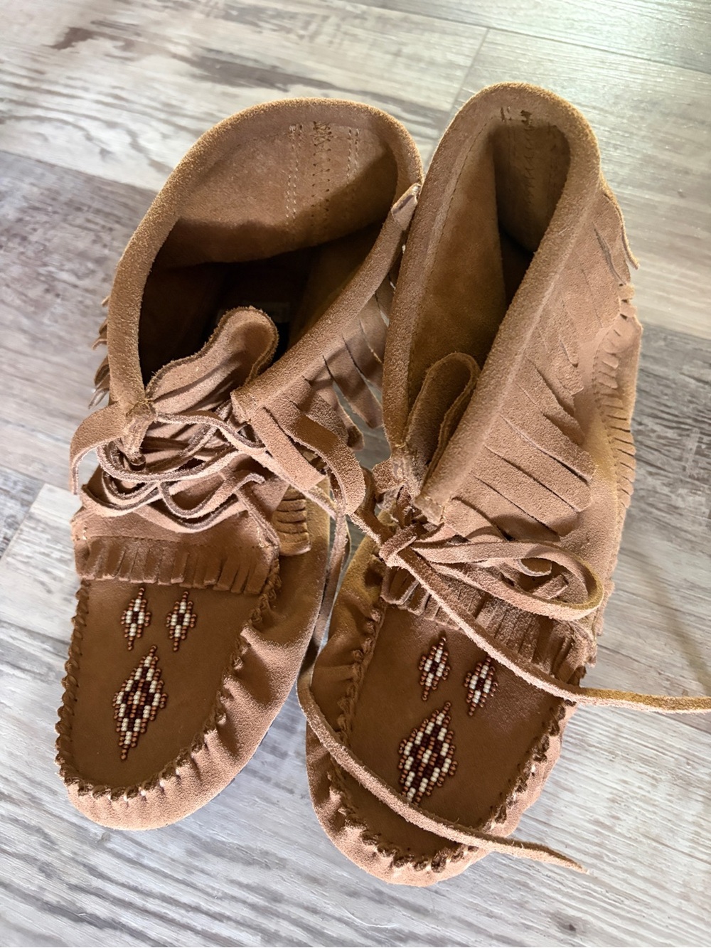 Women’s size 10 Manitobah moccasins. Never worn.